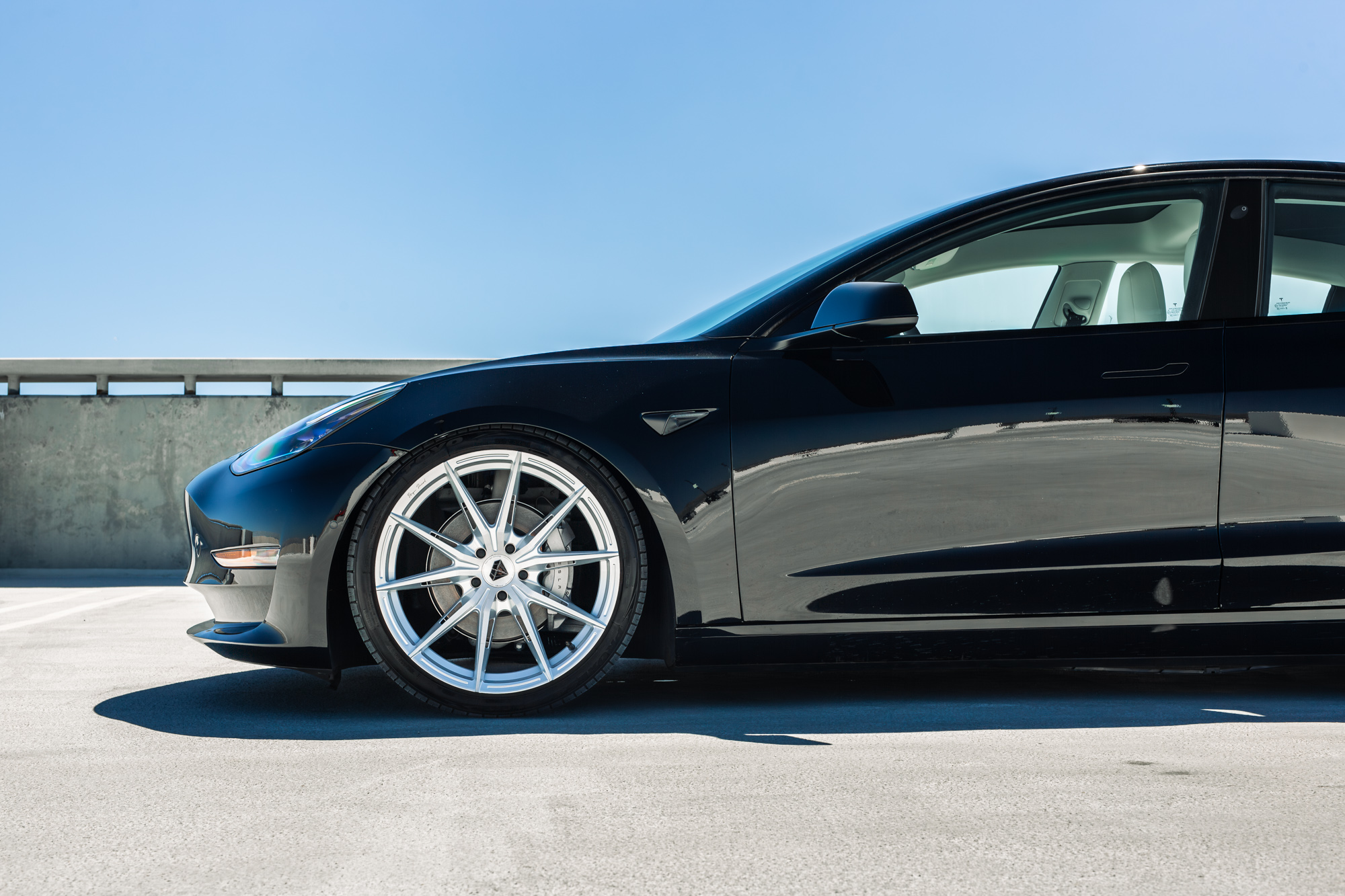 A 2022 Tesla Model 3 with Blaque Diamond BD-F29 Brushed Silver Wheels