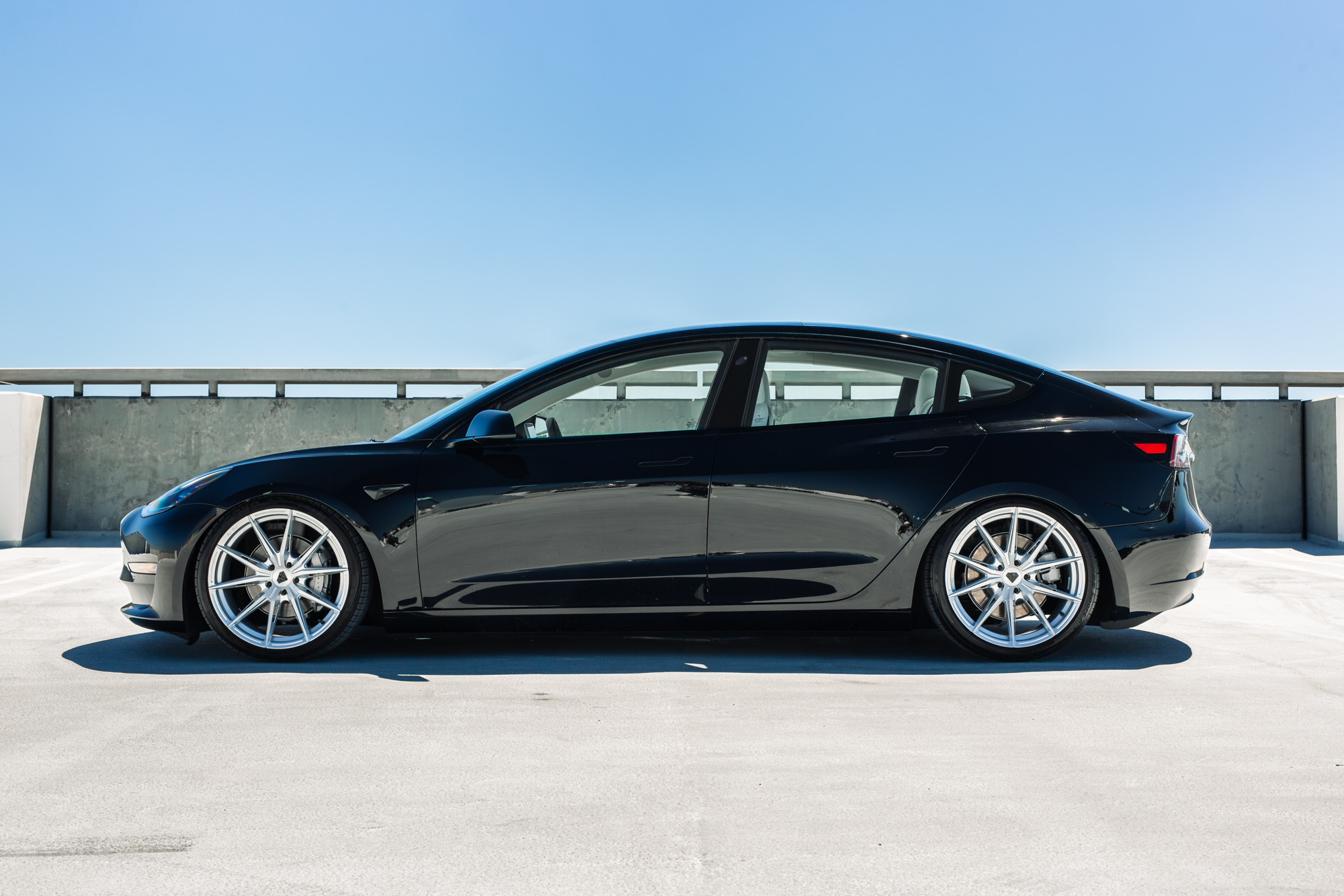 A 2022 Tesla Model 3 with Blaque Diamond BD-F29 Brushed Silver Wheels