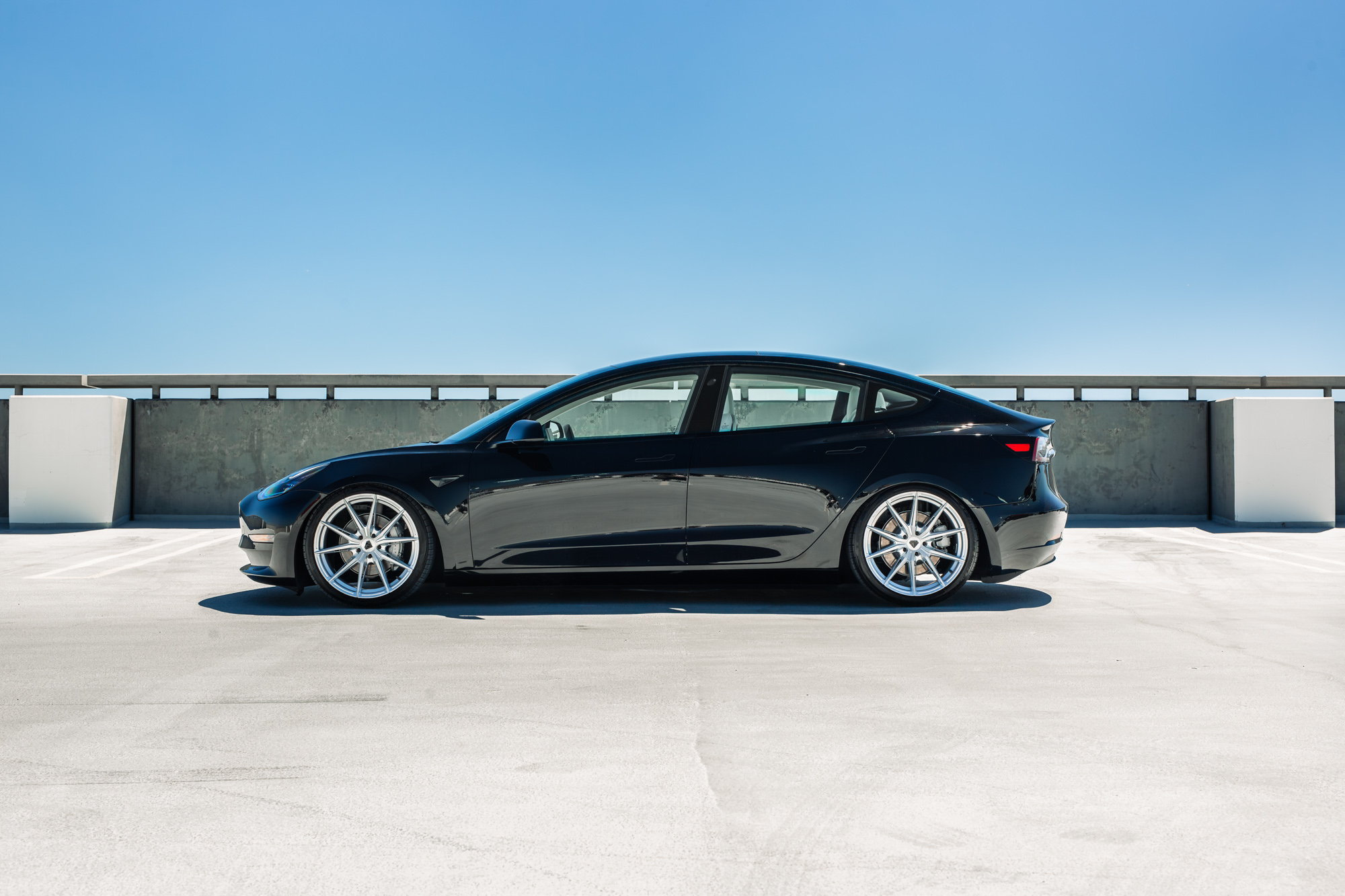 A 2022 Tesla Model 3 with Blaque Diamond BD-F29 Brushed Silver Wheels