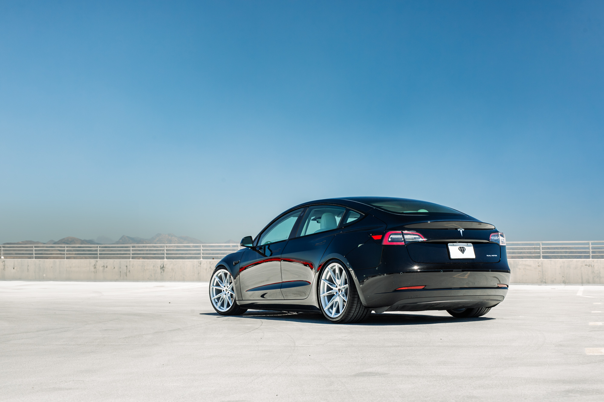 A 2022 Tesla Model 3 with Blaque Diamond BD-F29 Brushed Silver Wheels