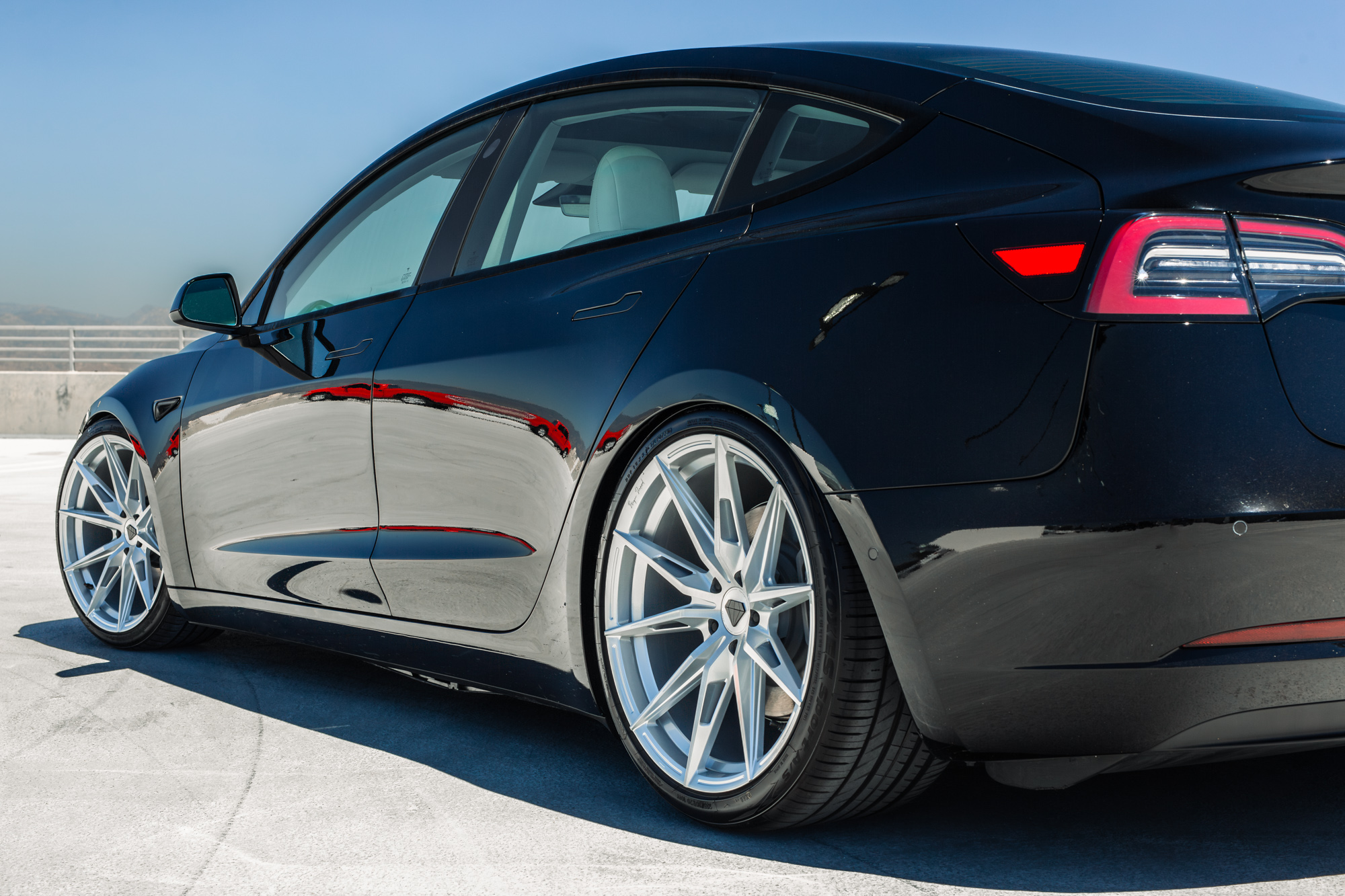 A 2022 Tesla Model 3 with Blaque Diamond BD-F29 Brushed Silver Wheels