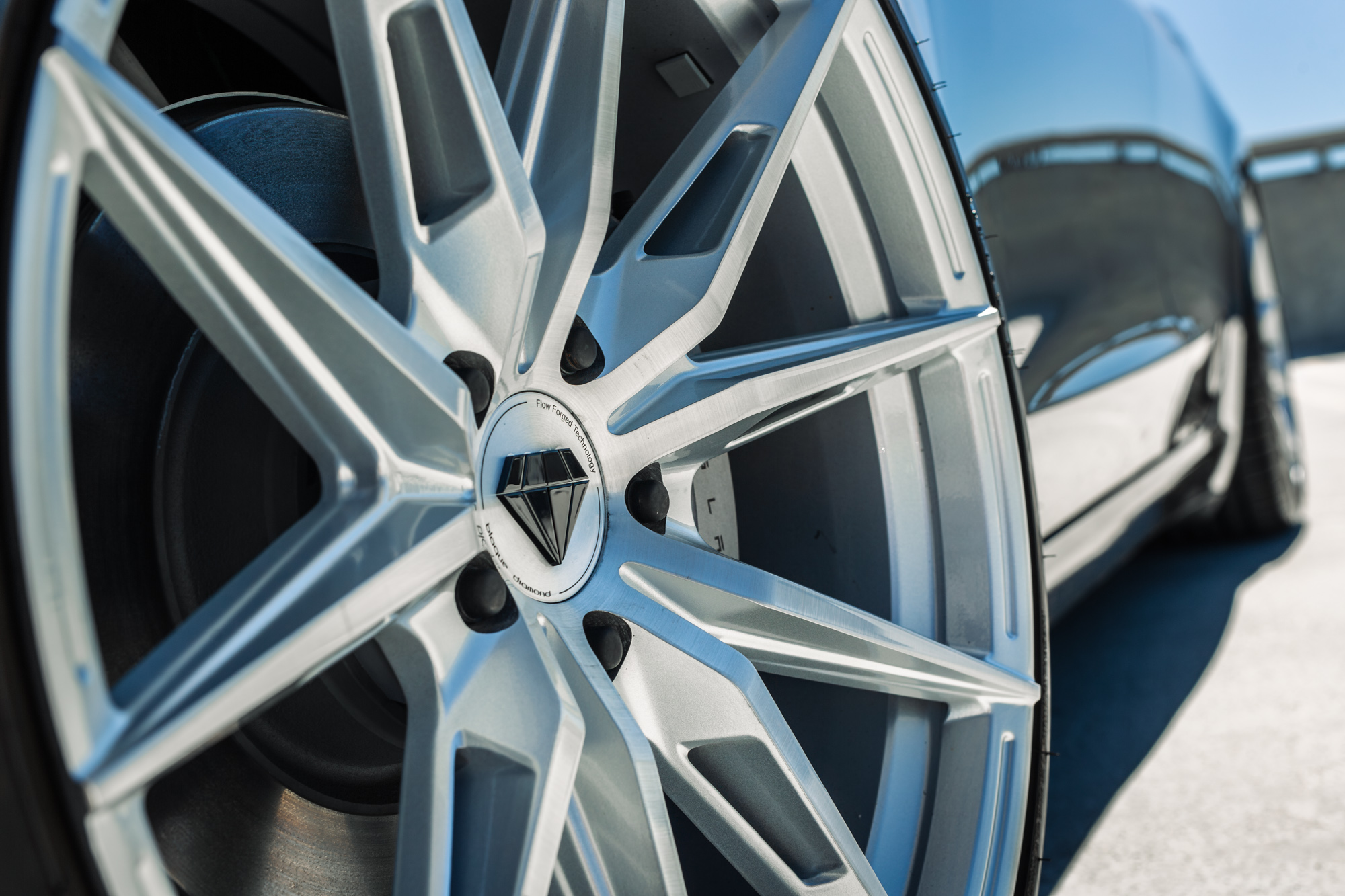 A 2022 Tesla Model 3 with Blaque Diamond BD-F29 Brushed Silver Wheels