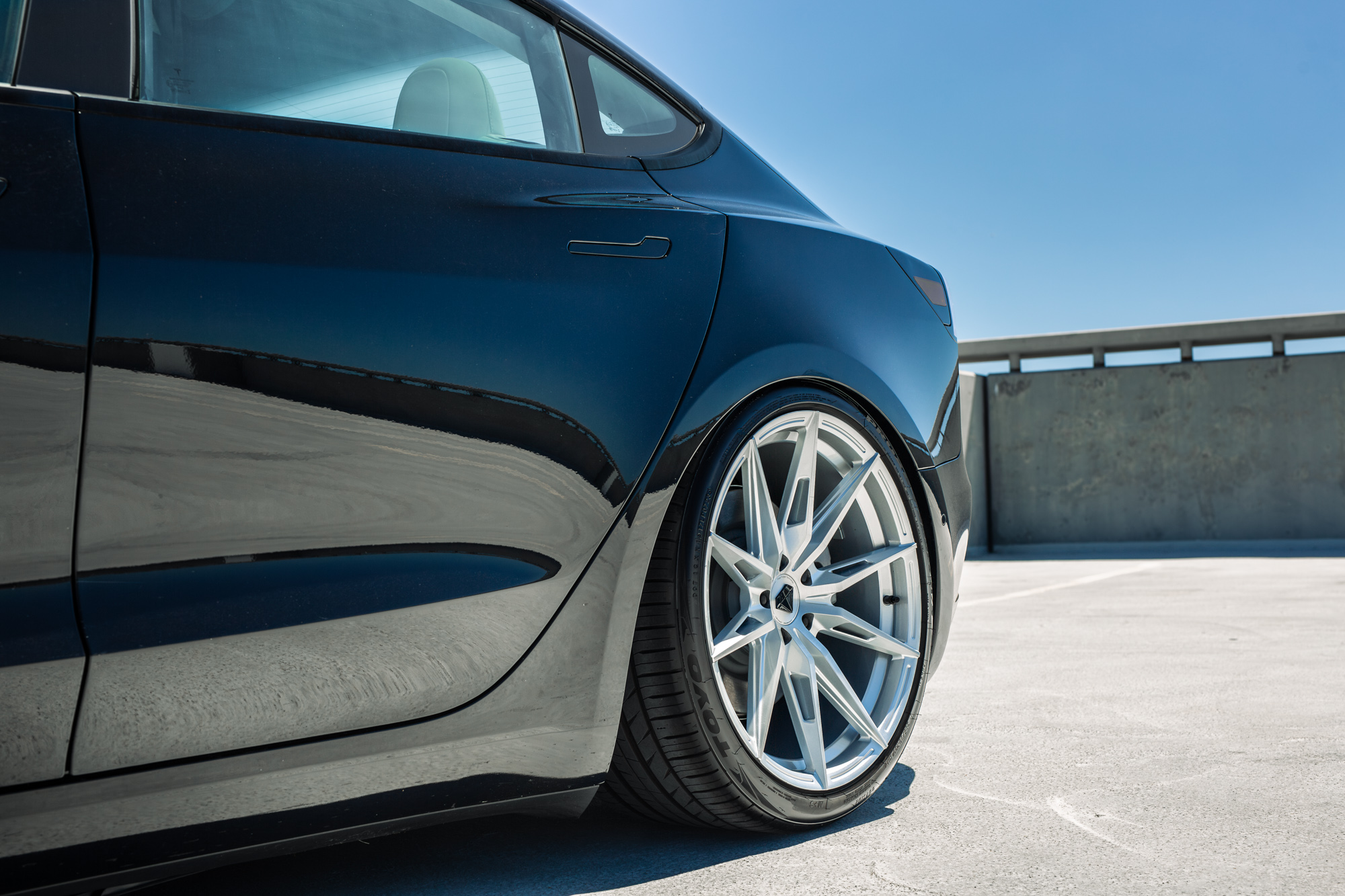 A 2022 Tesla Model 3 with Blaque Diamond BD-F29 Brushed Silver Wheels