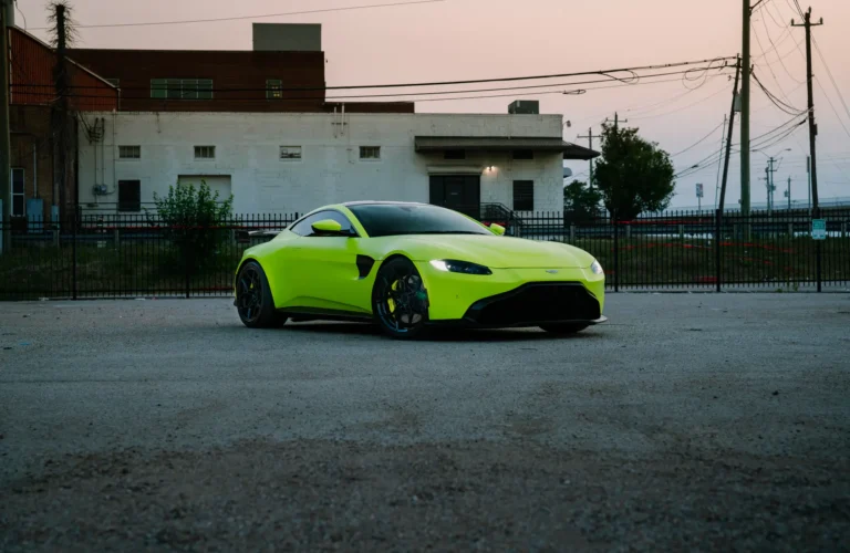 Striking 2022 Aston Martin Vantage in Neon Green equipped with Blaque Diamond BD-F25 Gloss Black Flow Forged Wheels, delivering style and performance.